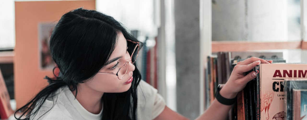 A woman looking at books.