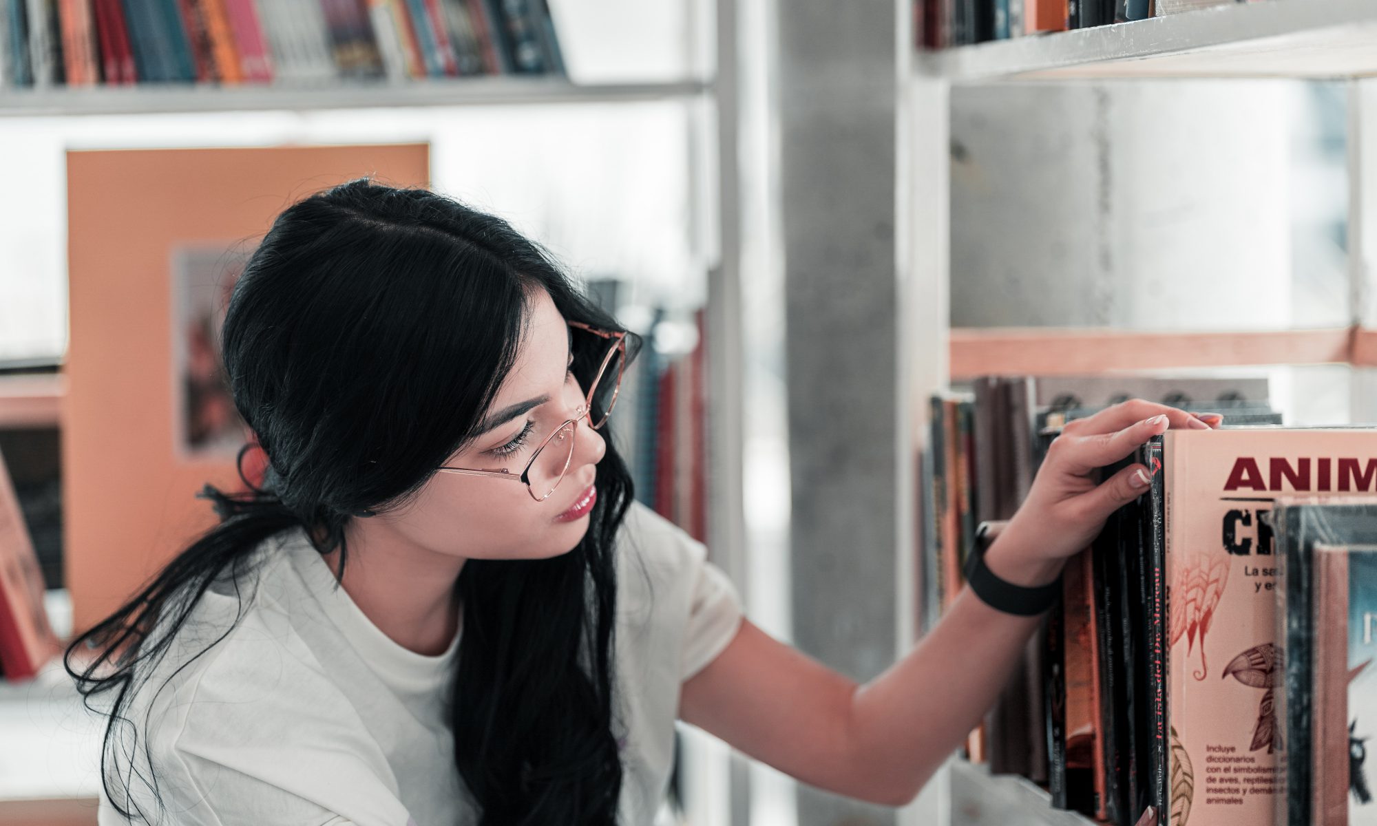 A woman looking at books.