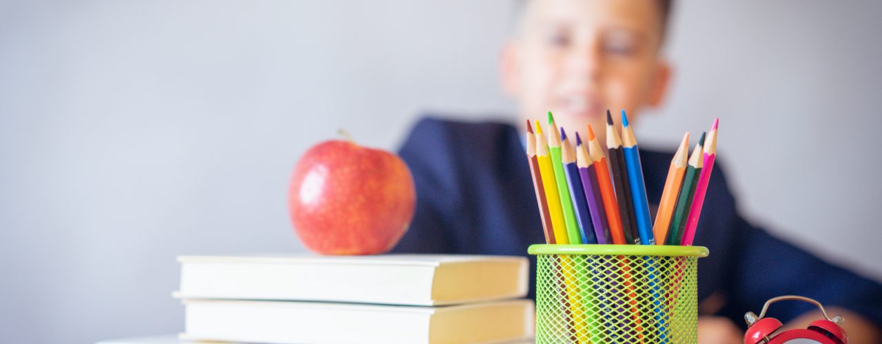 School supplies and a child.