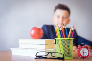 School supplies and a child.