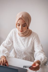 A woman buying something online on her laptop.