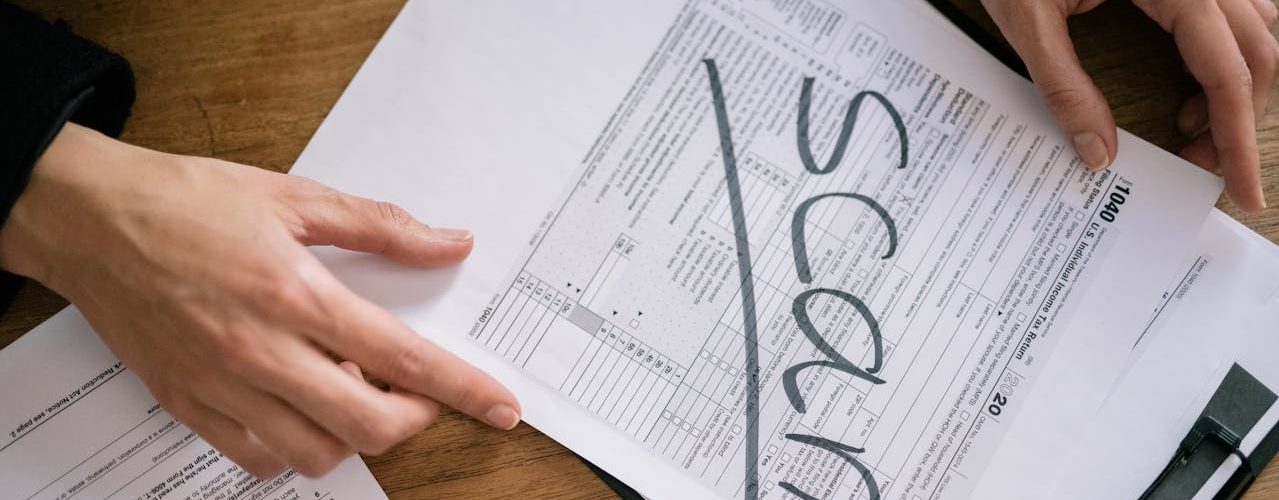 Documents that have the word "scam" written in large font.