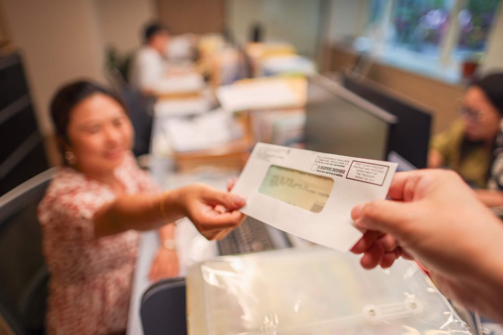 A woman receiving a tax refund check.