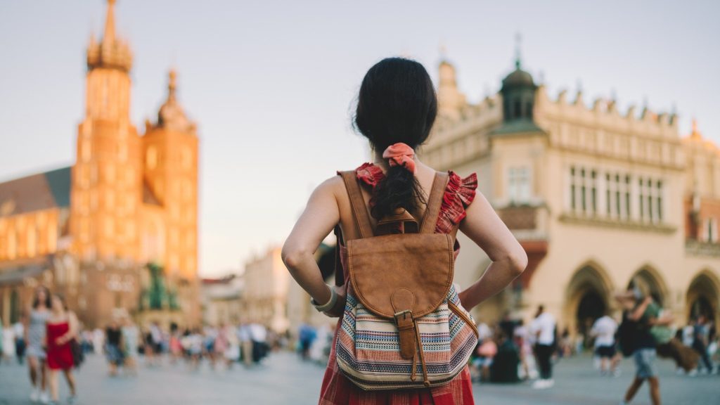 A woman woman exploring Europe as a traveler.