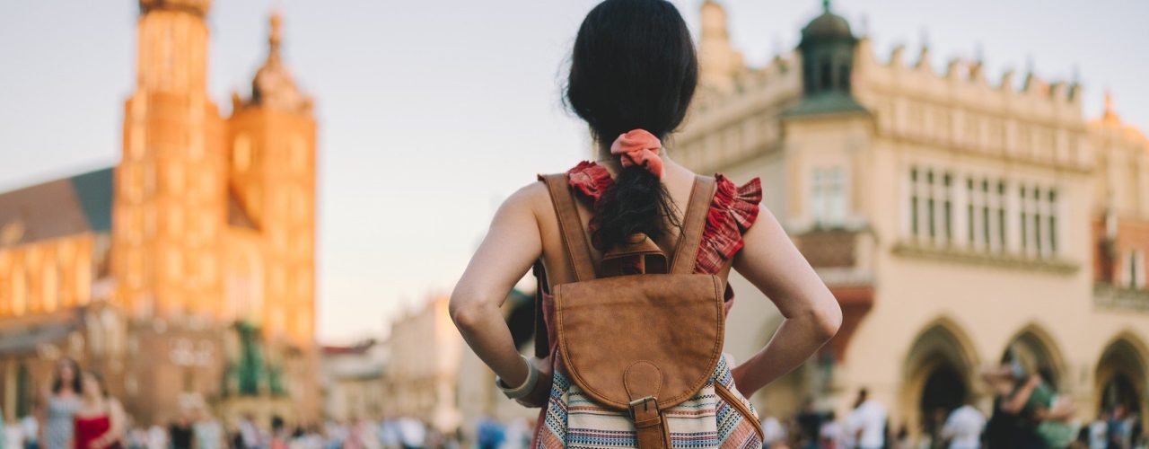 A woman woman exploring Europe as a traveler.