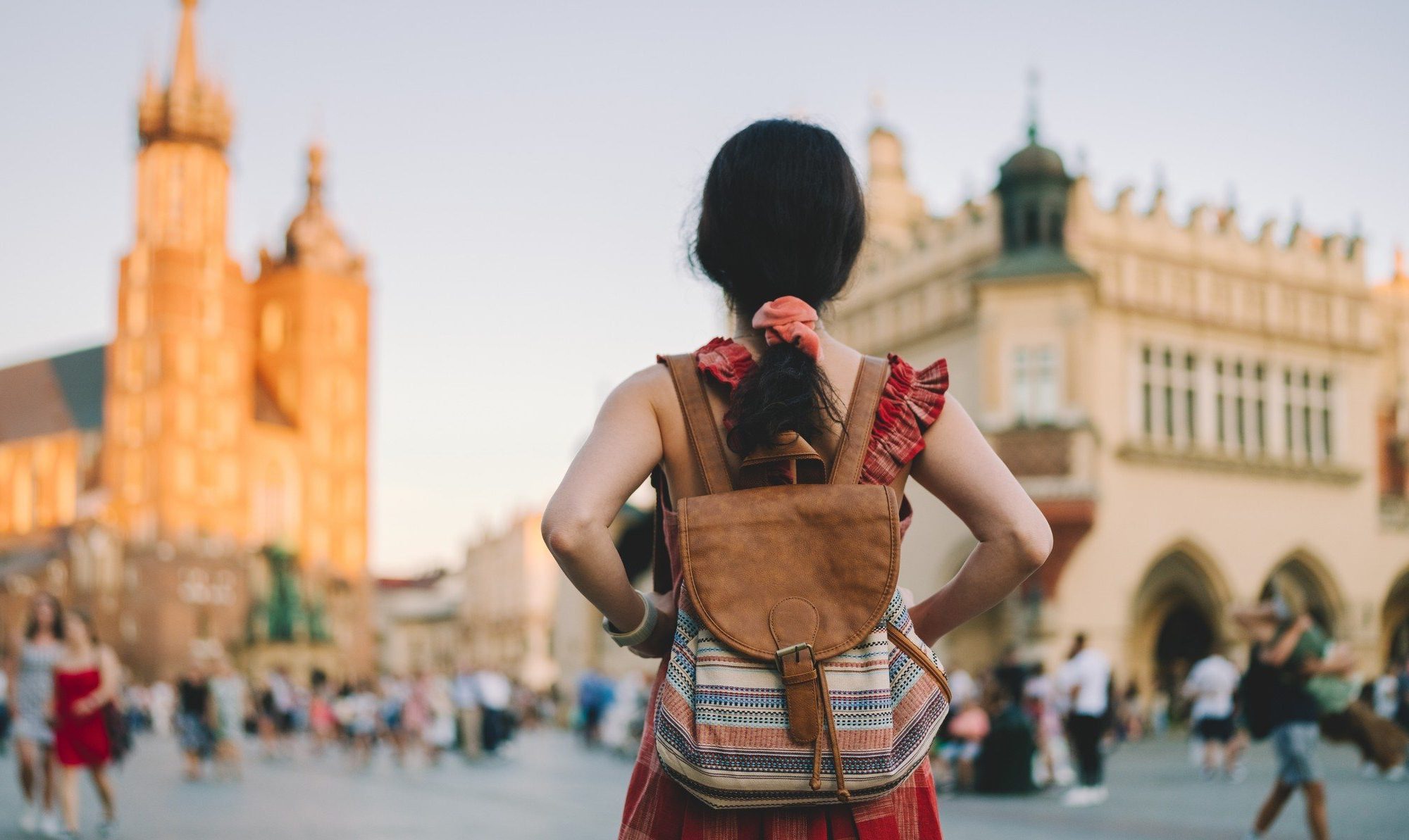 A woman woman exploring Europe as a traveler.