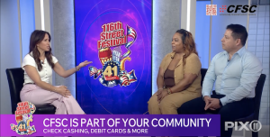 TV studio interview about the 116th Street Festival: a host on the left speaks to two guests on the right, with a festival logo on a digital screen behind them and station logos visible at the edges.